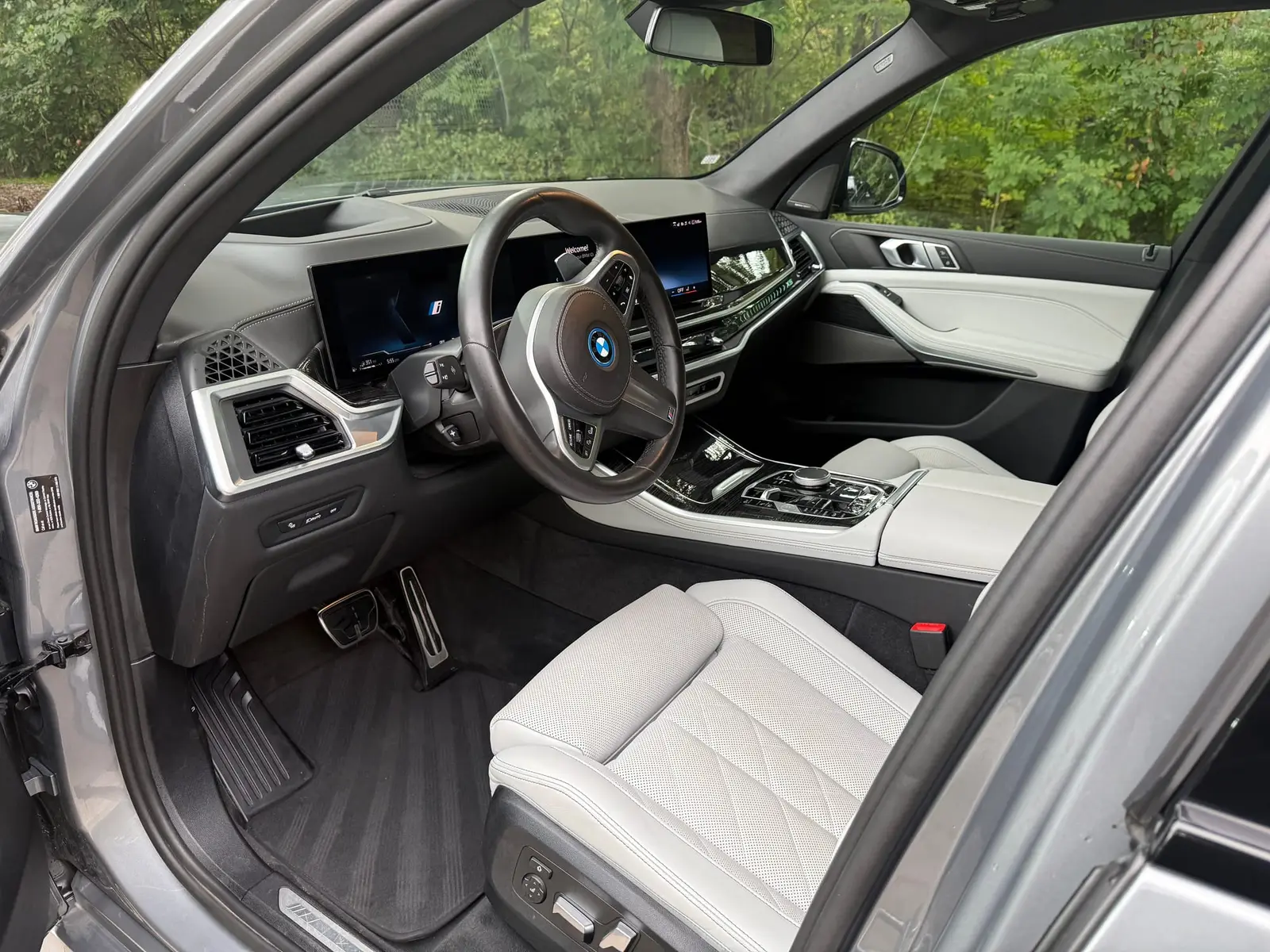 BMW X5 white leather interior after a mobile interior detail by A&F Auto Detailing in Oakland Township, MI