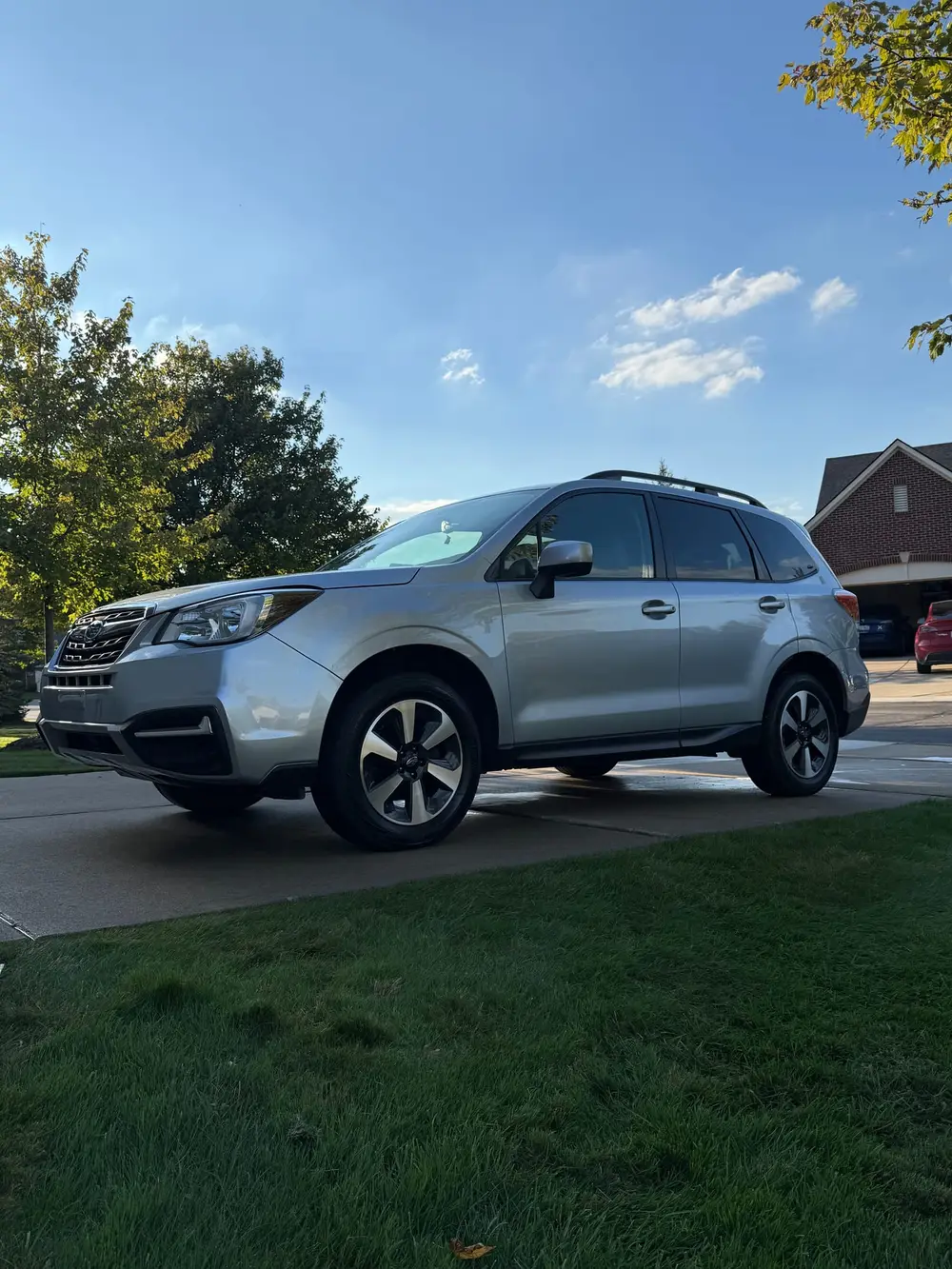 Silver Subaru Forester in a driveway after a full-service mobile detail by A&F Auto Detailing in Commerce Township, MI