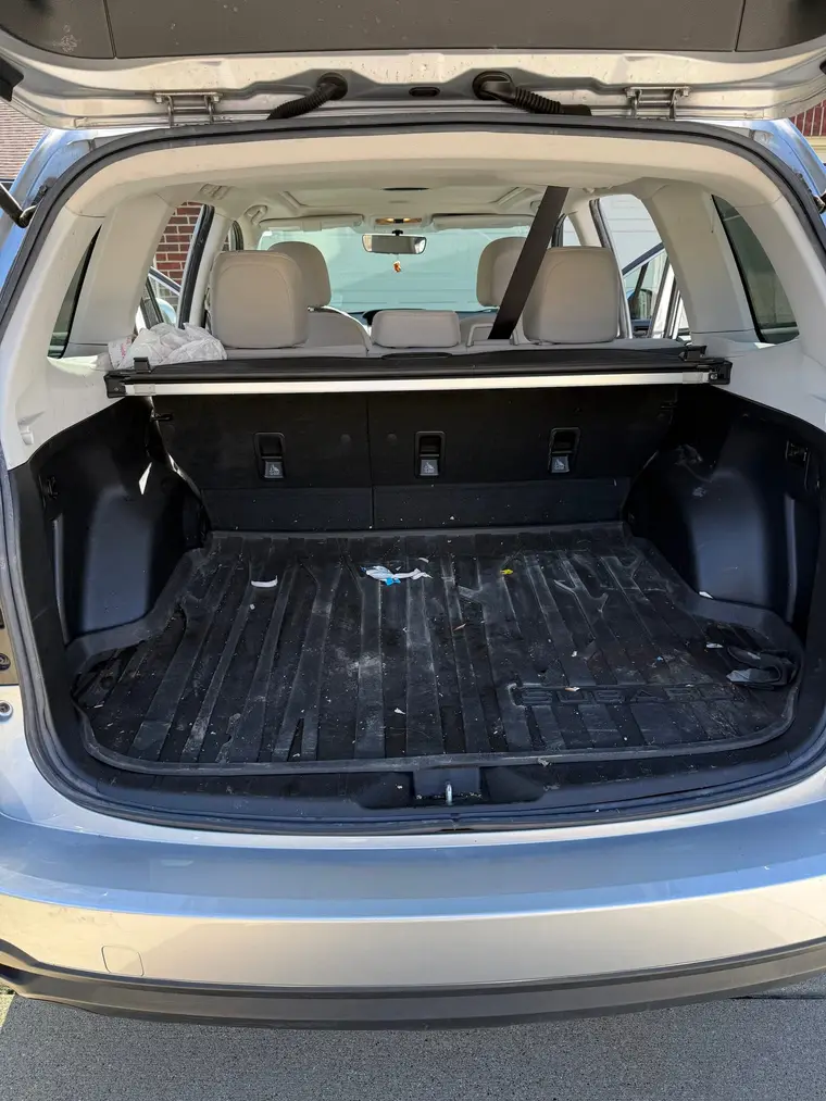 Silver Subaru Forester cargo area with debris before a mobile interior detail by A&F Auto Detailing in Commerce Township, MI
